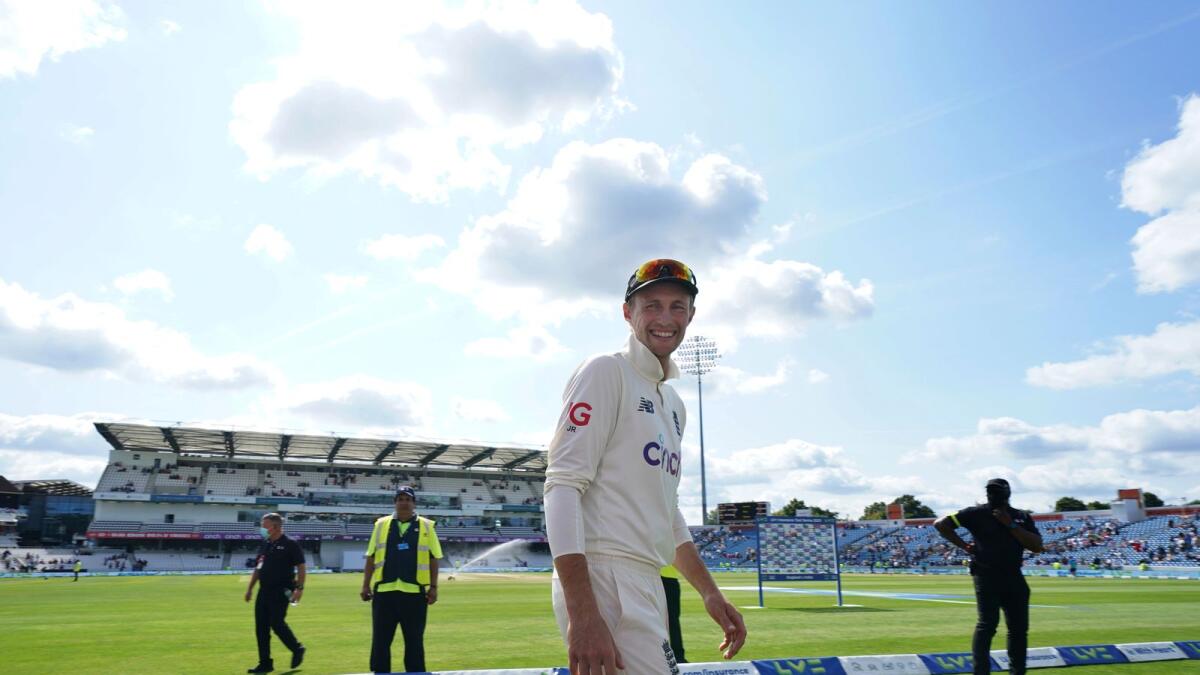 England captain Joe Root smiles as he leaves after the presentation ceremony after their win on the fourth day of third Test against India.— AP