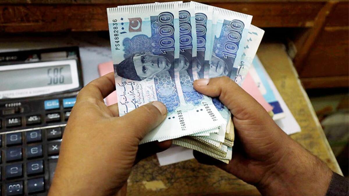 In the intraday trading, the local unit made a historical drop of Rs4 in a single day and surpassed Rs204 threshold against the greenback (55.58 against the dirham), however it recovered some ground in the final session. — File photo