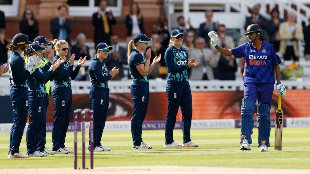 England players give India's Jhulan Goswami a guard of honour at Lord's. — Reuters