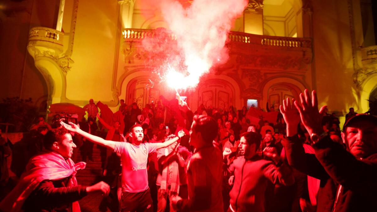 Morocco fan lets off a flare after the team's win against Portugal in Tunis. — Reuters