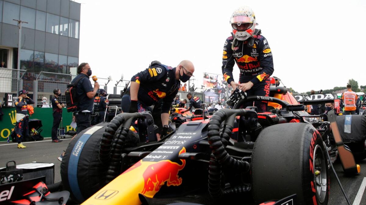 Red Bull's Dutch driver Max Verstappen gets into his car ahead of the Formula One Hungarian Grand Prix at the Hungaroring race track in Mogyorod near Budapest. — AFP