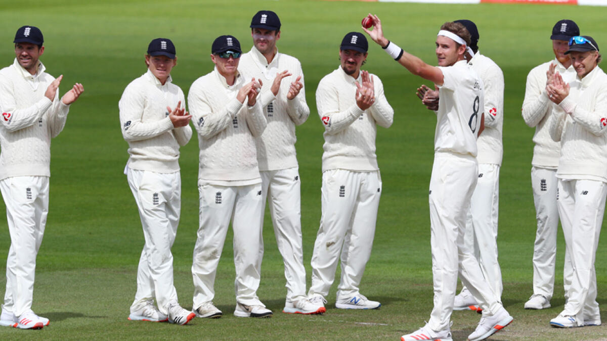 England's Stuart Broad (sixth from left) celebrates taking his 500th Test wicket after dismissing West Indies' Kraigg Brathwaite. - Reuters
