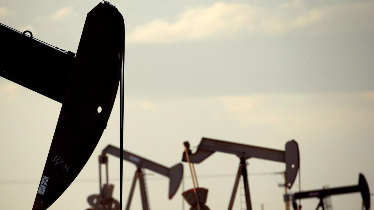 Pumpjacks work in a field near Lovington, N.M. The United States consumes 20 million barrels of crude a day, the most in the world, and its output has never exceeded 13 million bpd. — AP file photo