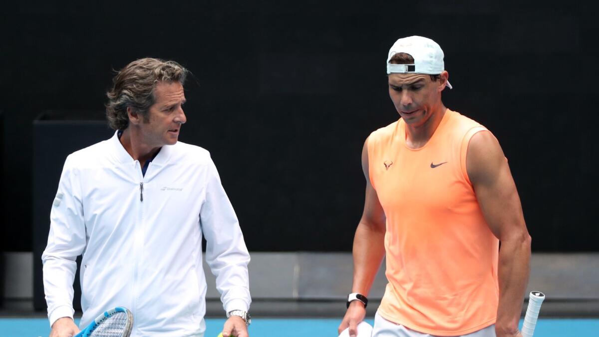 Spain's Rafael Nadal with coach Francisco Roig during a practice session.— Reuters