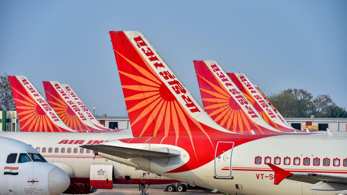 Air India planes are parked at the IGI Airport in New Delhi. Air India has agreed to purchase 250 Airbus planes, split between 210 single-aisle A320neos and 40 widebody A350s, and 220 Boeing aircraft including 190 of its 737 MAX narrowbody jets, 20 787 widebodies and 10 777Xs. — PTI