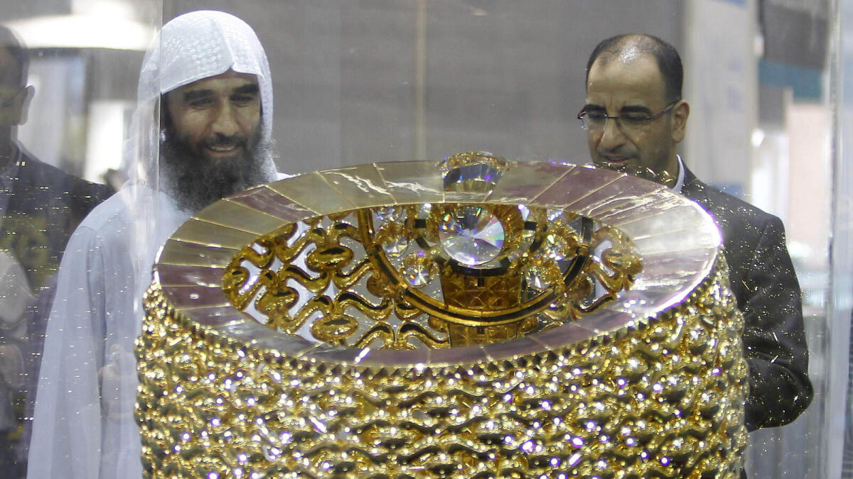 Visitors looking at the world’s heaviest gold ring from KSA that is displayed at the 39th Watch and jewellery show at the Expo center in Sharjah. – Photo by M.Sajjad/Khaleej Times