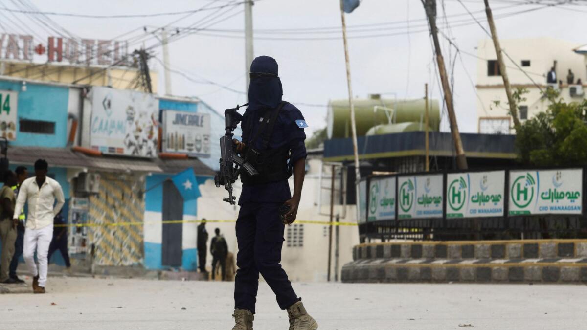 A Somali security officer walks at the entrance of Hotel Hayat. – Reuters