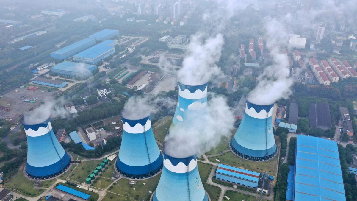Steam billows out of the cooling towers at a coal-fired power station in Nanjing in east China's Jiangsu province. The International Energy Agency predicts Asia will consume half of the world's electricity by 2025. A new report by the Paris-based body forecasts that China alone will see its share of global electricity consumption grow from a quarter in 2015 to a third by the middle of this decade. — AP