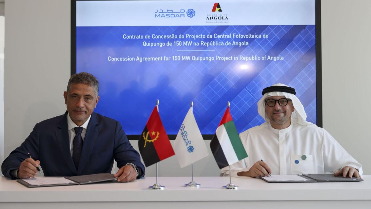 Mohamed Jameel Al Ramahi and Joao Baptista Borges sign the agreement to develop solar power plant in Angola. - Wam