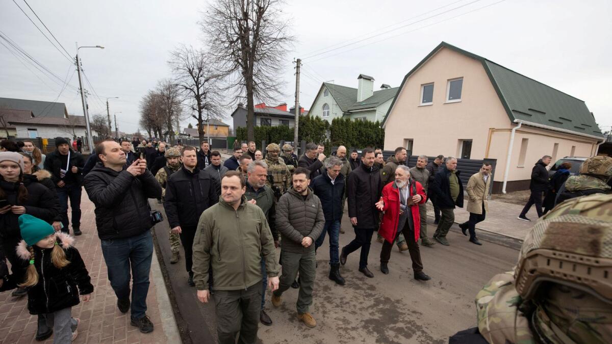Slovenia's Prime Minister Robert Golob, Ukraine's President Volodymyr Zelensky, Moldovan President Maia Sandu, Croatian Prime Minister Andrej Plenkovic and Slovakian Prime Minister Eduard Heger visit the town of Bucha marking the first anniversary of its liberation, amid Russia's attack on Ukraine, outside of Kyiv, on Friday. — Reuters