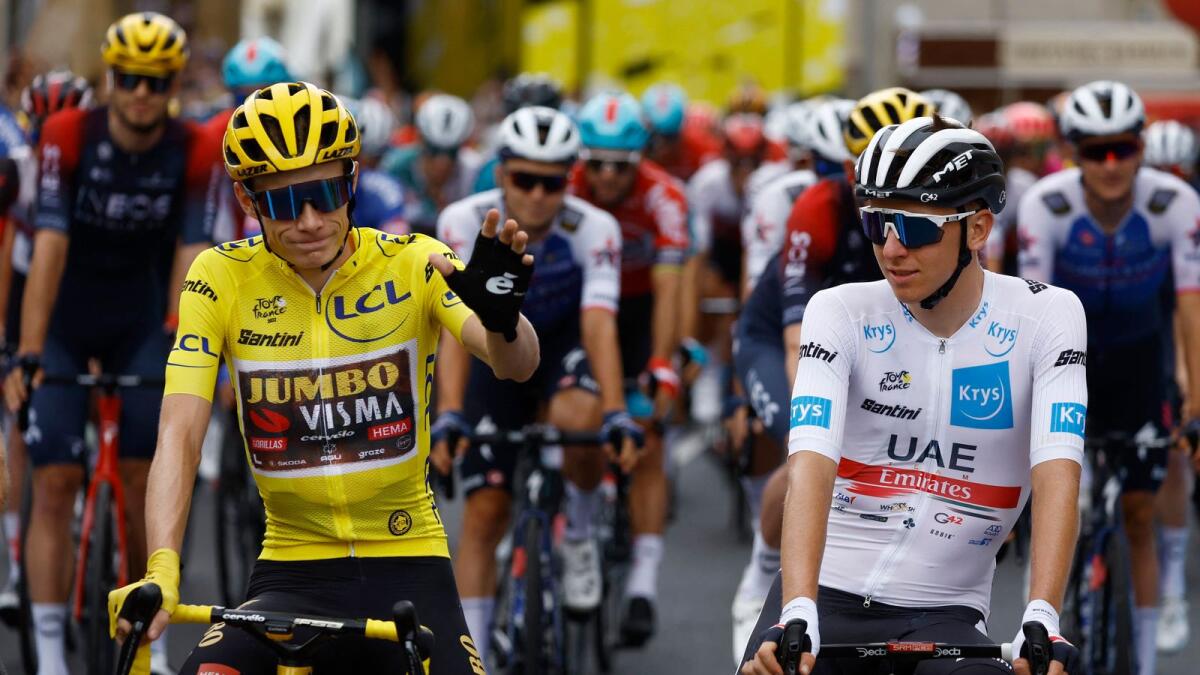 Jumbo-Visma's Jonas Vingegaard (left) and UAE Team Emirates' Tadej Pogacar before the 19th stage of the Tour de France on Friday. — Reuters