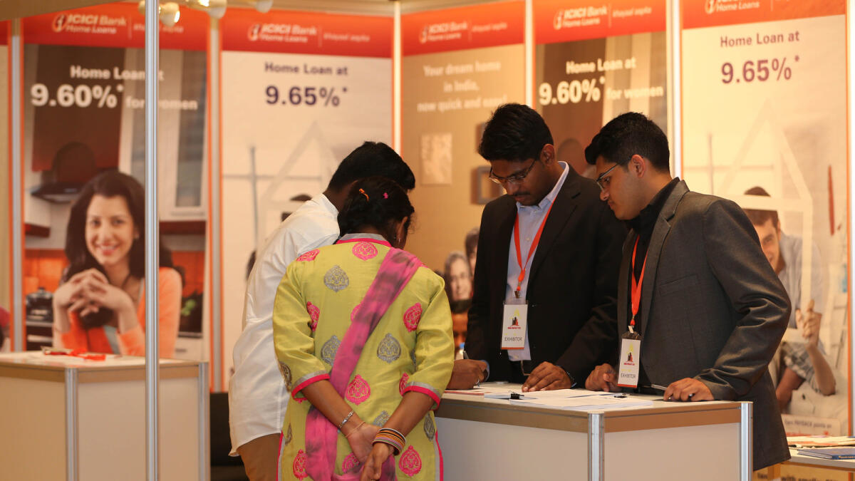 Event organiser Pradeep Pinto and visitors enquiring about property projects during India Property Fest at Emirates Palace in 	Abu Dhabi on Friday.