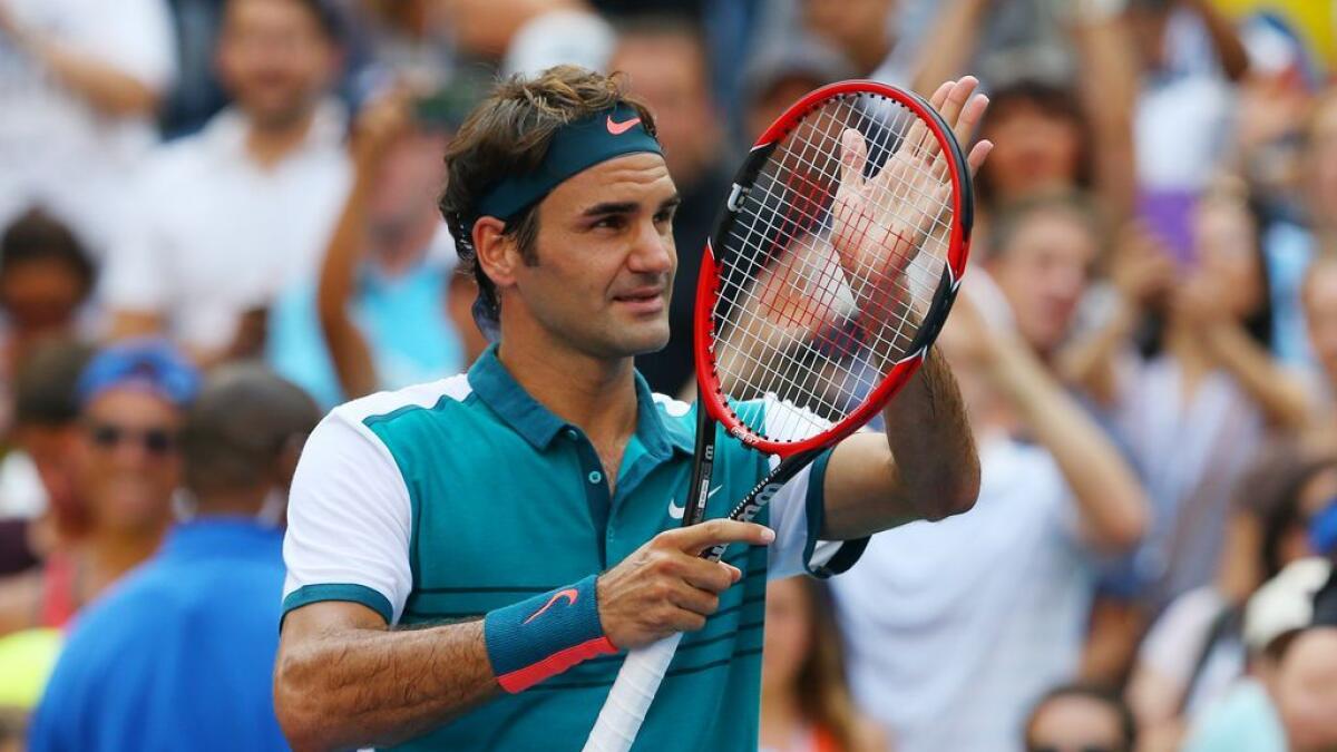Roger Federer of Switzerland waves to the crowd after defeating Leonardo Mayer of Argentina on day two of the 2015 US Open tennis tournament at USTA Billie Jean King National Tennis Centre.