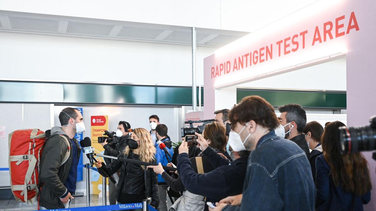 A passenger undergoing a swab test for Covid-19 in Milan. Photo: AFP
