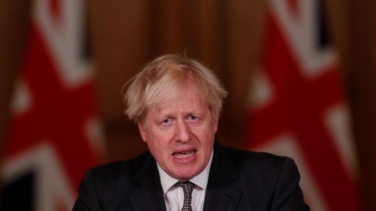 Britain's Prime Minister Boris Johnson speaks during a news conference announcing tightening of COVID-19 tiers, at Downing Street in London, Britain December 30, 2020.