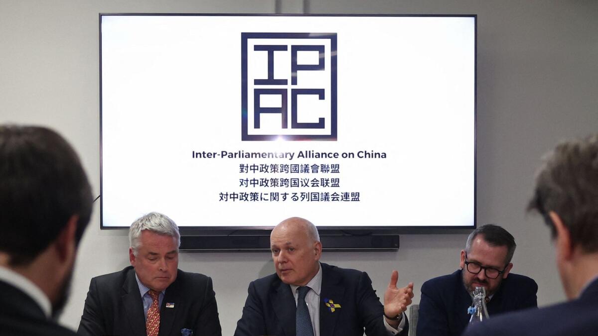 (L-R) Conservative MP Tim Loughton, former Conservative leader, Iain Duncan Smith and SNP’s former defense spokesman Stewart McDonald from the Inter-Parliamentary Alliance on China, hold a press conference in central London on March 25. Prime Minister Rishi Sunak said the UK would 'do what is required' to protect itself from a cyber attack by China. — AFP