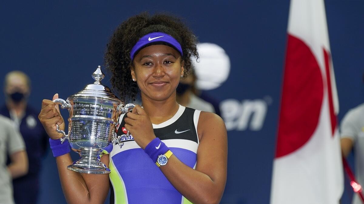 Naomi Osaka of Japan poses with trophy after defeating Victoria Azarenka of Belarus in the final. (AP)
