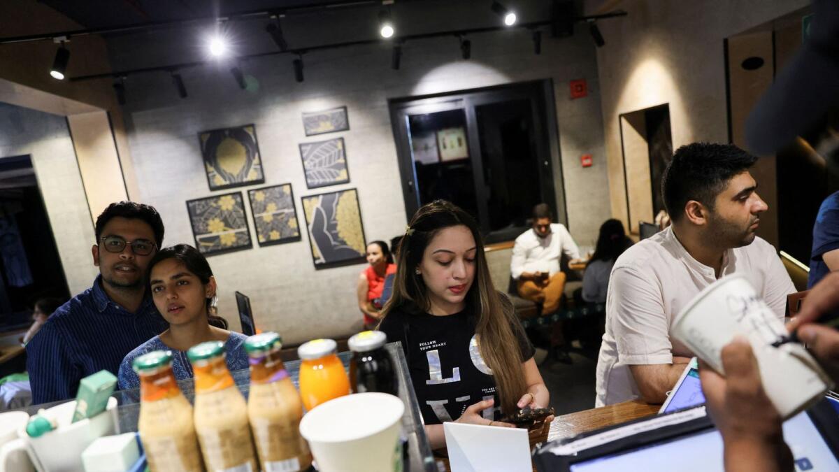 Customers stand next to a counter at a Starbucks' outlet at a market in New Delhi, India, on May 30, 2023. Photo: Reuters