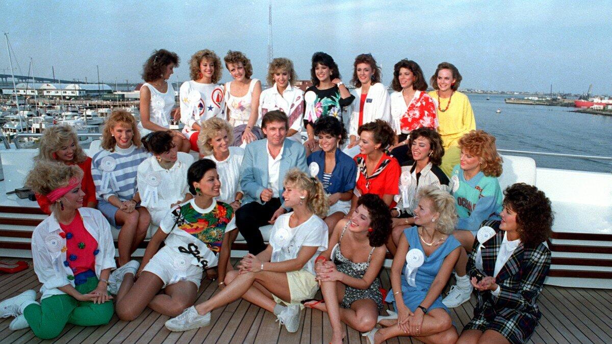 Donald Trump poses with about half of the competing State Misses on board his yacht in Atlantic City, N.J., on Sept. 4, 1988.