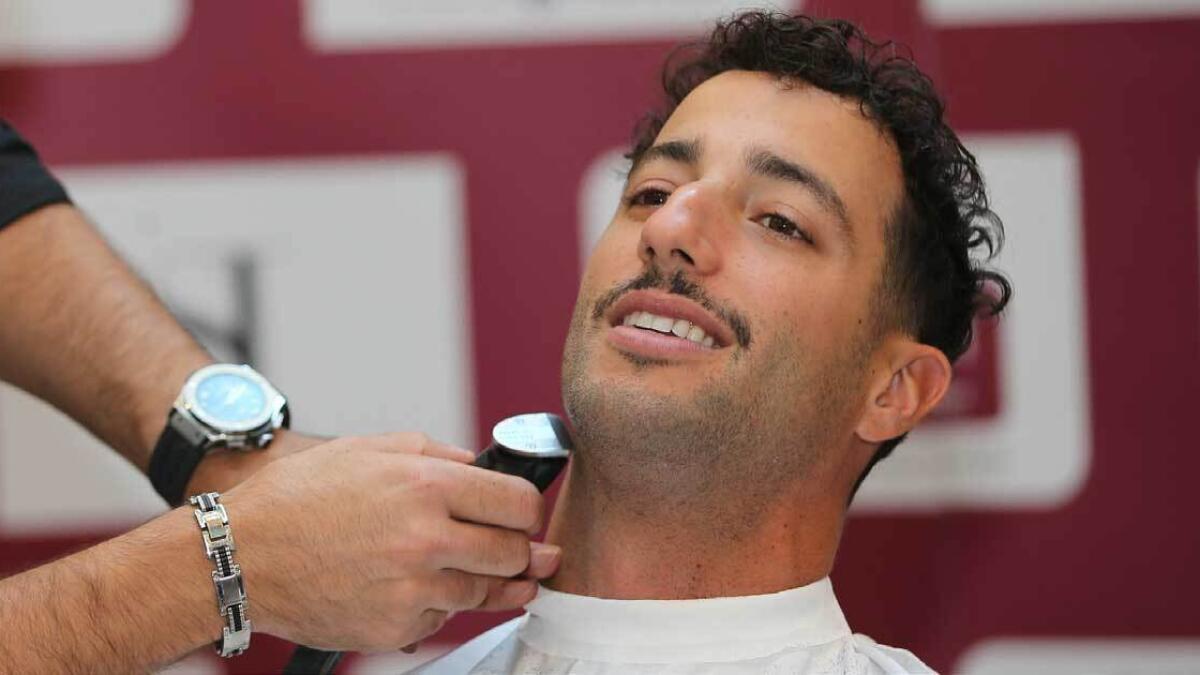 Daniel Ricciardo shaves off his beard as part of the Movember camp[aign in Abu Dhabi on Wednesday. — Photo by Ryan Lim