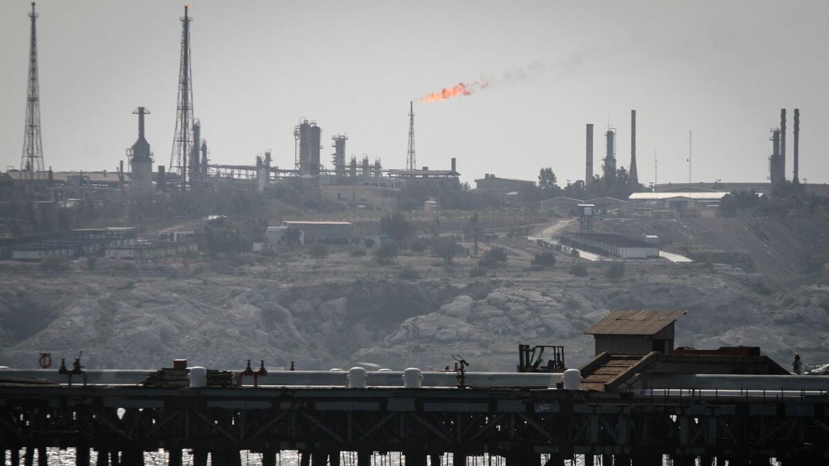 A picture shows an oil facility in the Khark Island, on the shore of the Gulf, on February 23, 2016.Iran's Oil Minister Bijan Namdar Zanganeh dismissed an output freeze deal between the world's top two producers Saudi Arabia and Russia as 'a joke', the ISNA news agency reported./ AFP PHOTO / STR