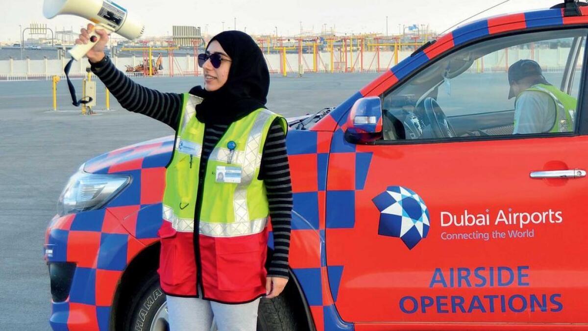 Emirati compliance and safeguarding officer Reem Al Saffar implements bird dispersal methods at the airport.