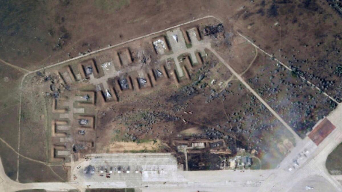 A satellite image shows destroyed Russian aircraft at Saki Air Base after an explosion. — AP