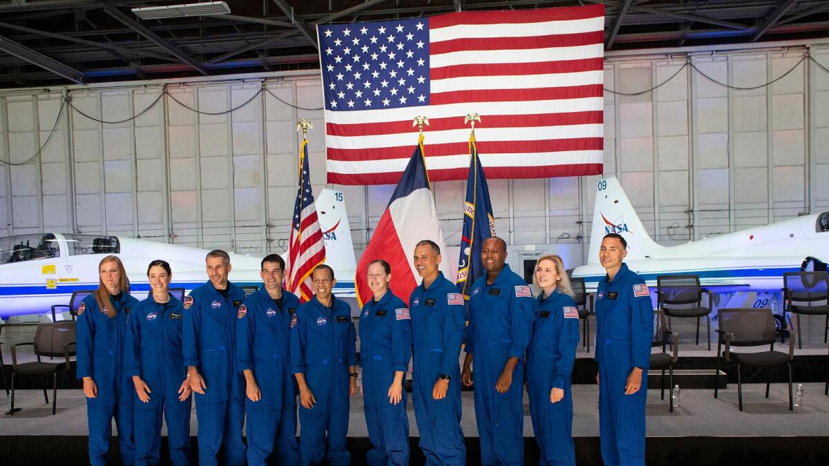 (L-R) Astronaut candidates Nichole Ayers, Christina Birch, Luke Delaney, Andre Douglas, Christopher Williams, Jessica Wittner, Anil Menon, Andre Douglas, Deniz Burnham and Marcos Berrios pose for a group photo at the NASA's 2021 Astronaut Candidate announcement event on December 6, 2021 at Ellington Field in Houston, Texas. (Photo: AFP)