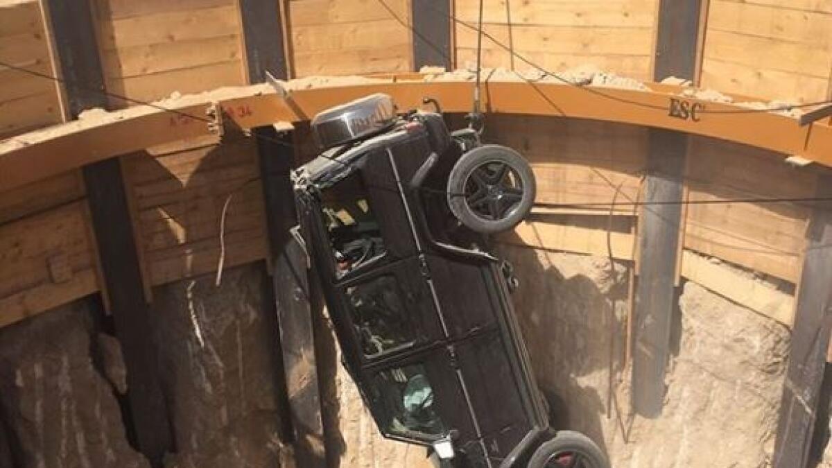 Dubai Police  rescues man after his car falls into 15-metre deep pit