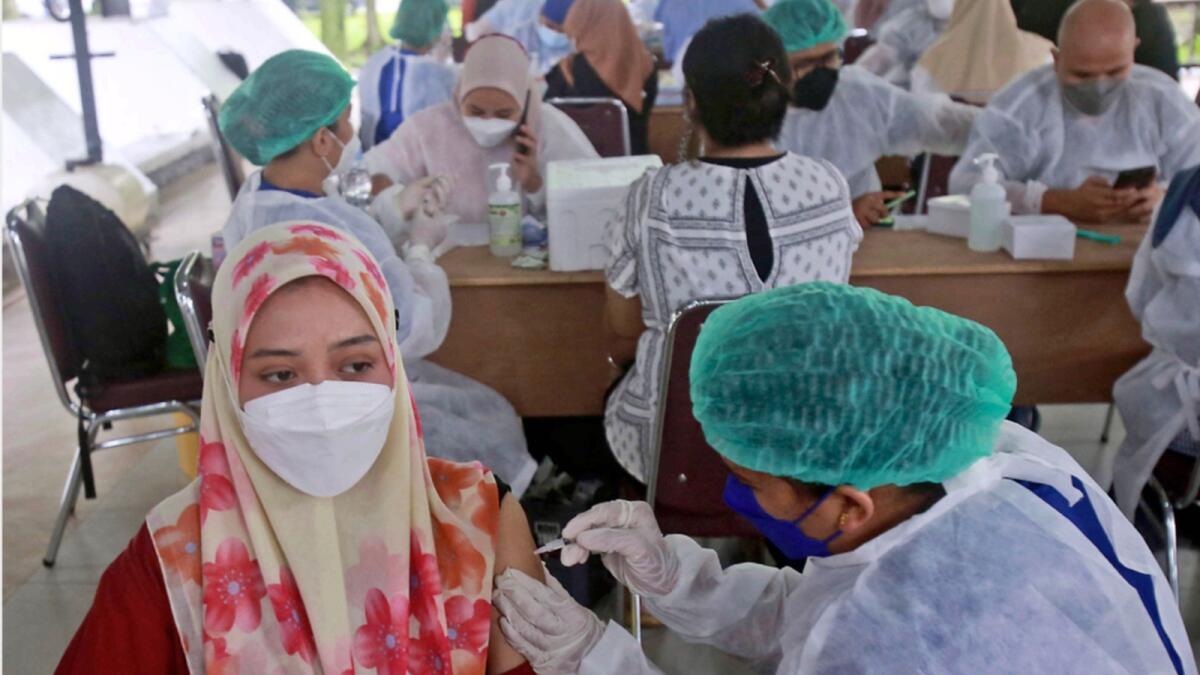 A woman receives Covid-19 vaccine in Indonesia. — AP file
