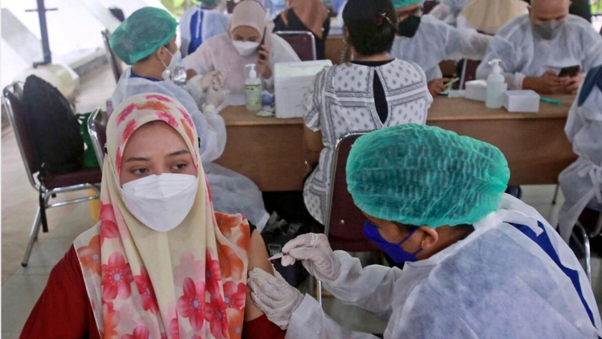 A woman receives Covid-19 vaccine in Indonesia. — AP file