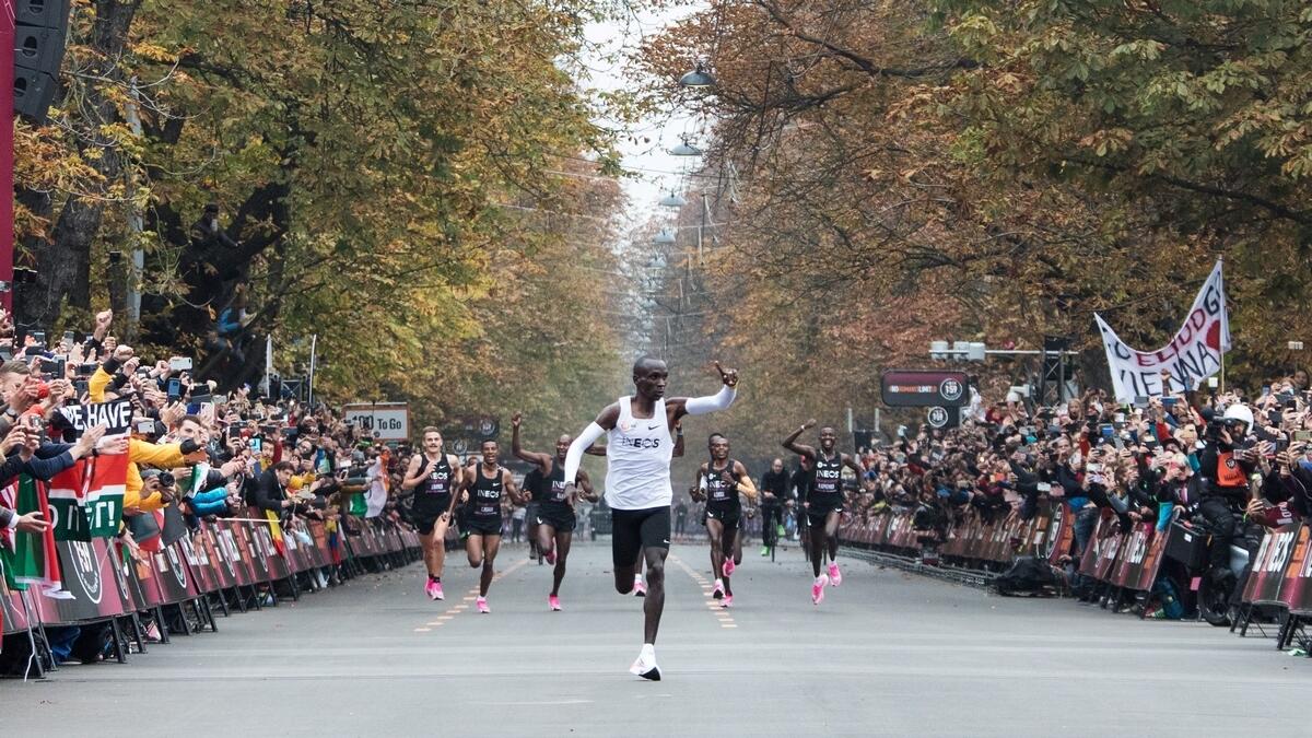Super-human Kipchoge busts mythical two-hour marathon barrier