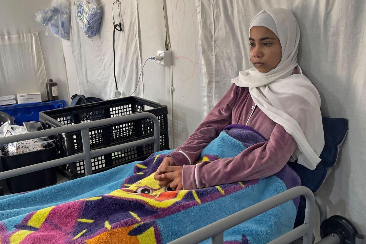This picture taken on March 6, 2024 shows Palestinian girl Hala Hazem Hamada taking rest inside a hospital in Rafah. — AFP