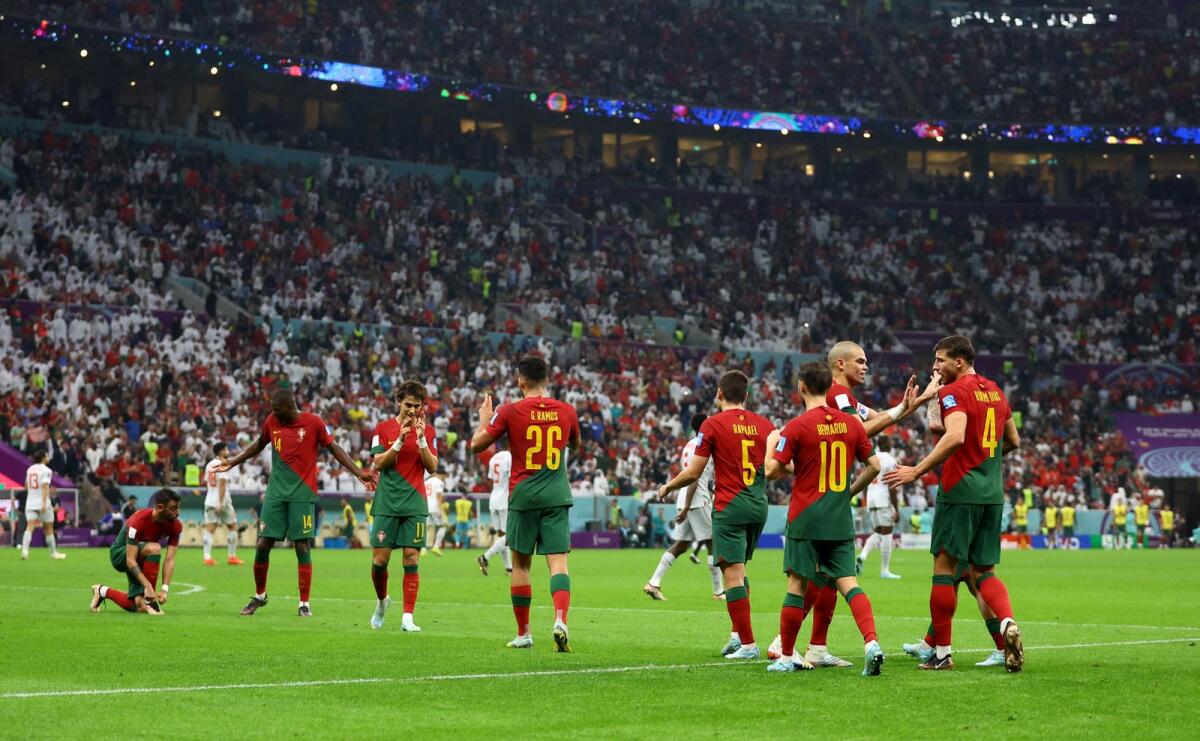 Portugal's Goncalo Ramos celebrates scoring their fifth goal and his hat-trick with teammates. Photo: Reuters