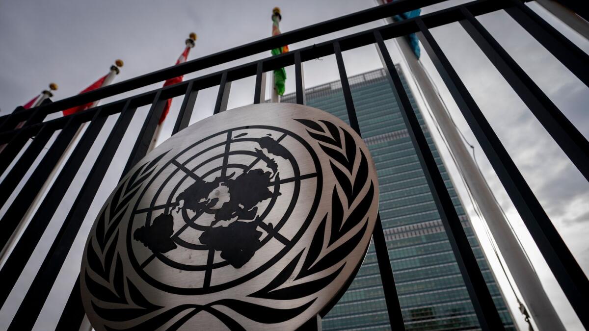 The symbol of the United Nations is displayed on the main gate outside UN headquarters. — AP file