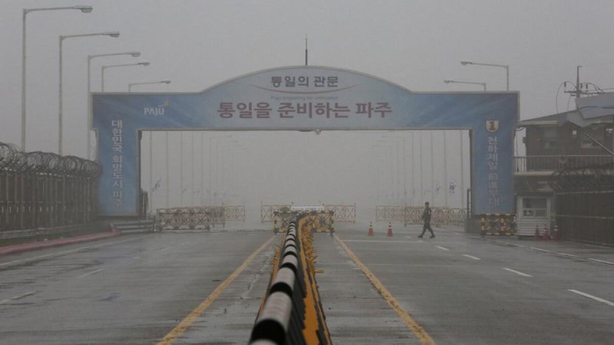 A South Korean army soldier walks on Unification Bridge, which leads to the demilitarized zone, near the border village of Panmunjom in Paju, South Korea.-AP 