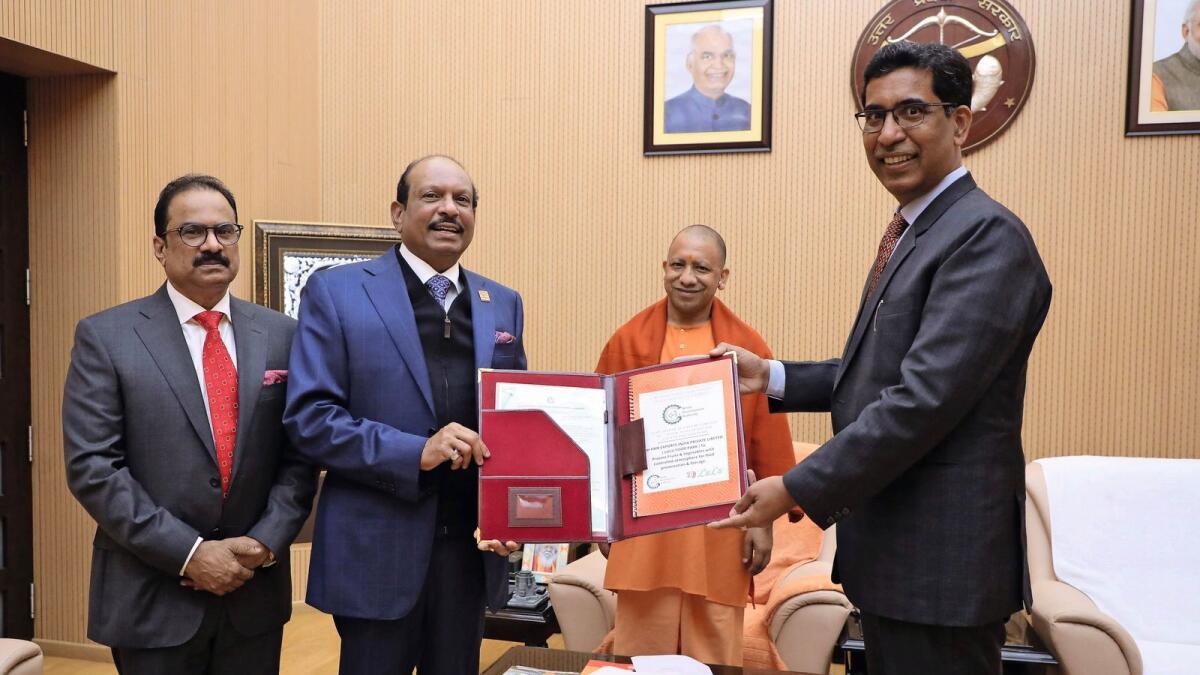 Narendra Bhoosan IAS, CEO of Greater Noida Development Authority, handing over the Land Allotment Order for the proposed LuLu Food Park in Greater Noida in Uttar Pradesh in the presence of Yogi Adityanath, Chief Minister of Uttar Pradesh.