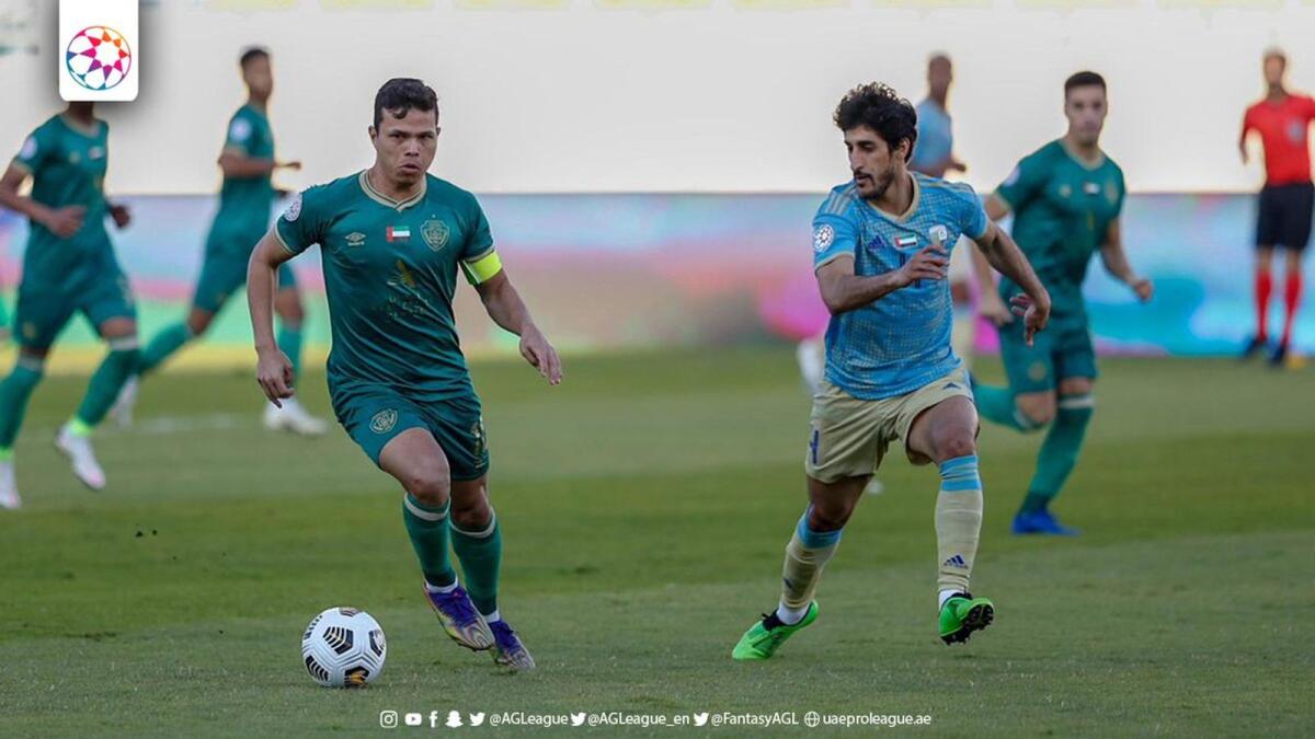 Al Dhafra and Al Wasl players are vying for the ball. — Twitter