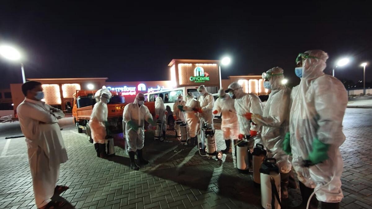 On Thursday night, heroic cleaning professionals, overseen by government authorities and heads of various municipalities were seen conducting the clean-up drive.— Photo by M. Sajjad