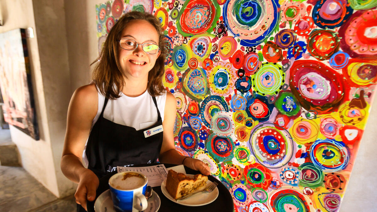 COFFEE BREAK ...“We’ve learned a lot of things here. I did some sculpture and painting. Today, I’ve got a new job — being in charge of the coffee shop,”  says Georgina Corley, 17, from UK.