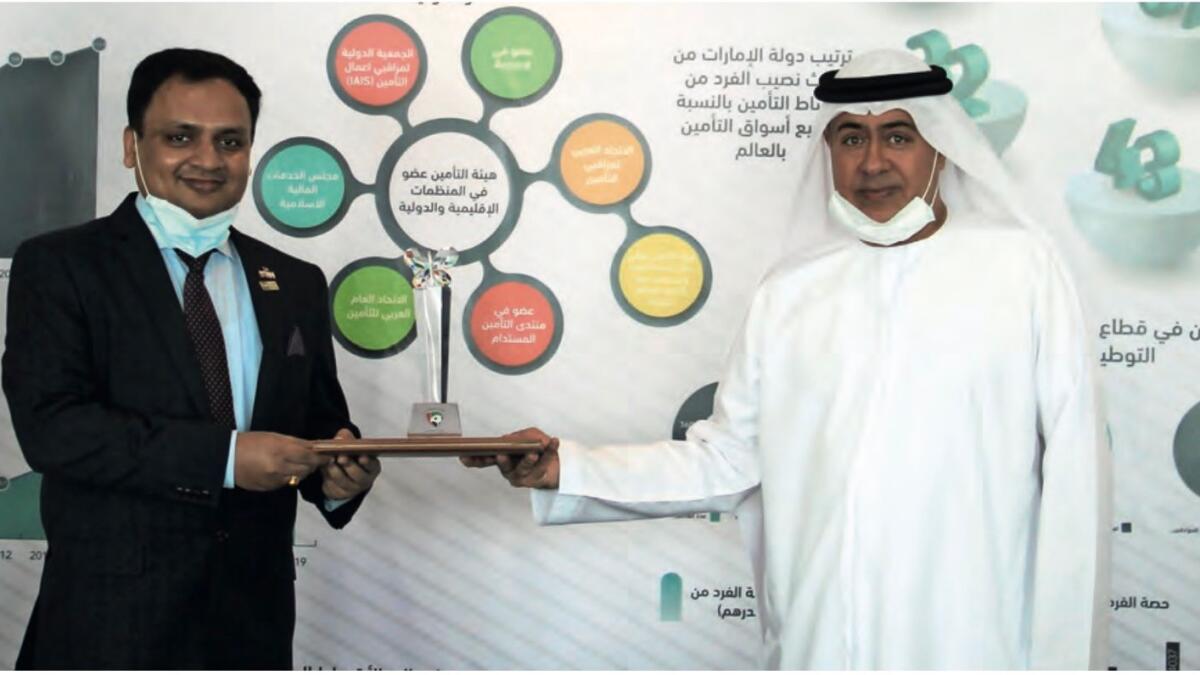 Pradeep Mishra, Resident Head, LIC International receives an award from H.E.Ebrahim Obaid Al Zaabi,Director General of Insurance Authority in the UAE