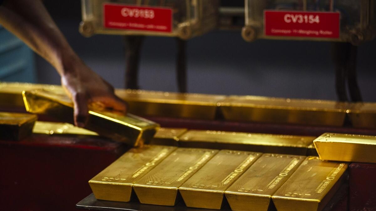 Spot gold edged higher by 0.1 per cent to $1,617.75 per ounce.