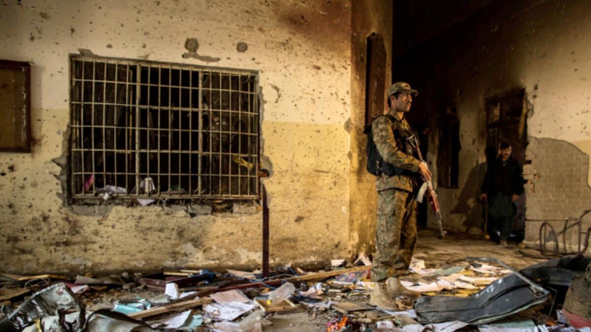An army soldier stands inside the Army Public School, which was attacked by Taliban gunmen, in Peshawar, December 17, 2014. — Reuters file