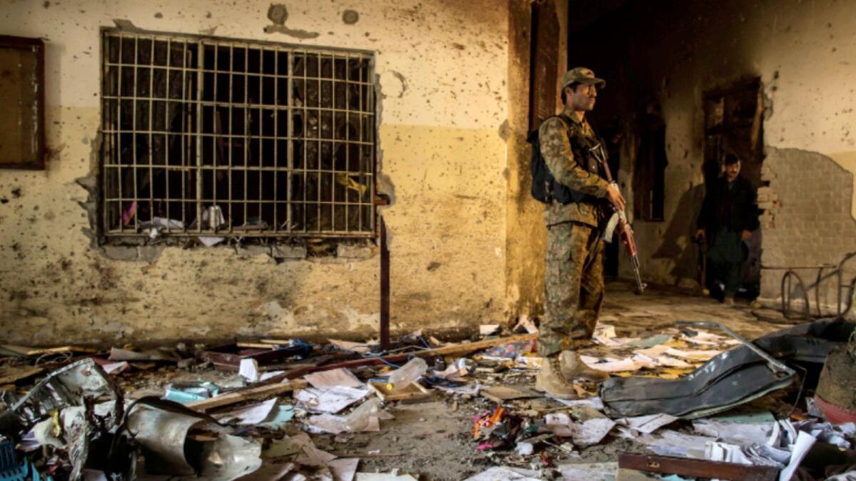An army soldier stands inside the Army Public School, which was attacked by Taliban gunmen, in Peshawar, December 17, 2014. — Reuters file
