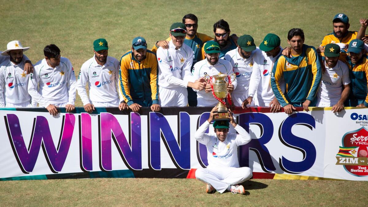 Pakistan cricket team pose with the trophy after winning the Test series against Zimbabwe at Harare Sports Club. — AP