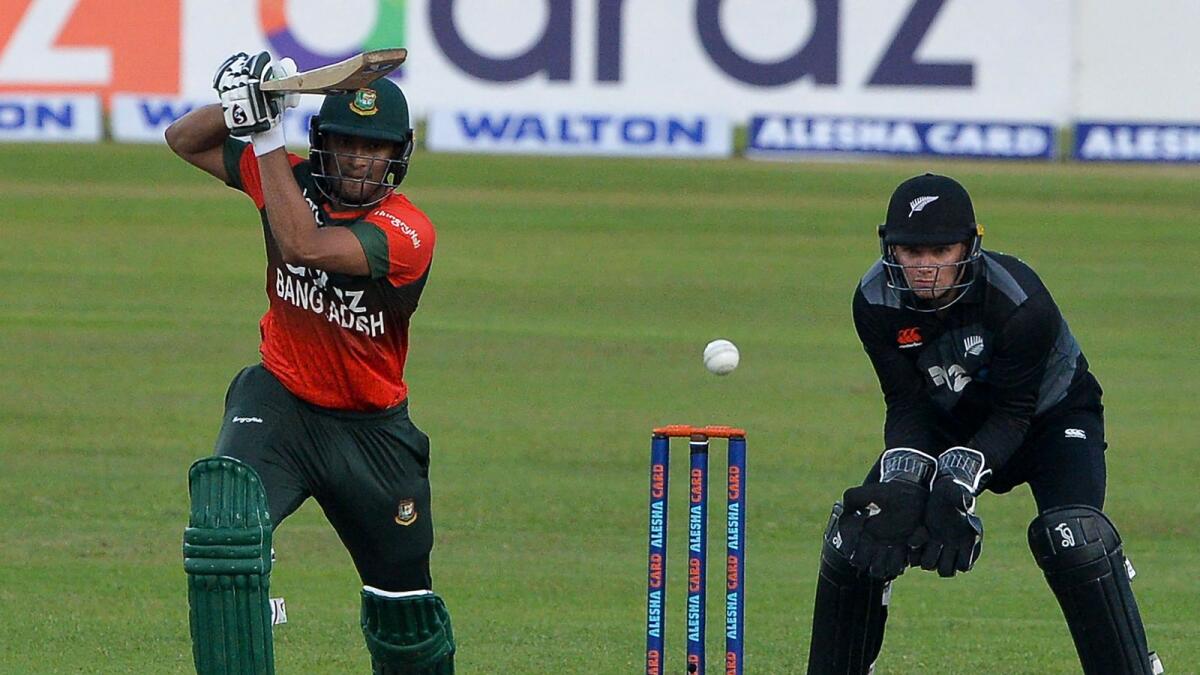 Bangladesh's Shakib Al Hasan (left) plays a shot during the first Twenty20  match against New Zealand. (AFP)