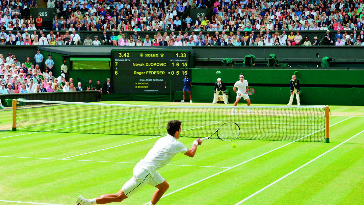 Novak Djokovic returns to Roger Federer during their 2015 men’s singles Wimbledon final. — AFP