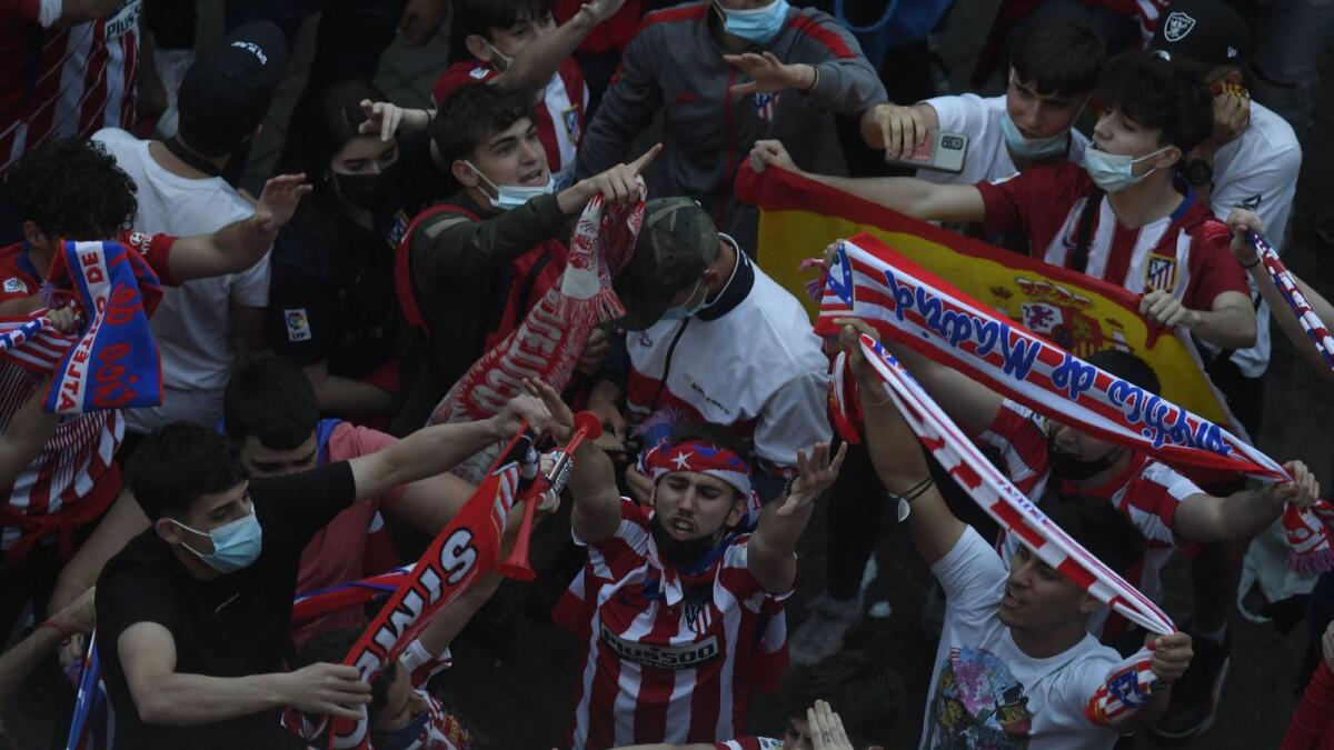 Supporters gather at Neptuno square in Madrid after Atletico Madrid won the Spanish Liga Championship title. — AFP
