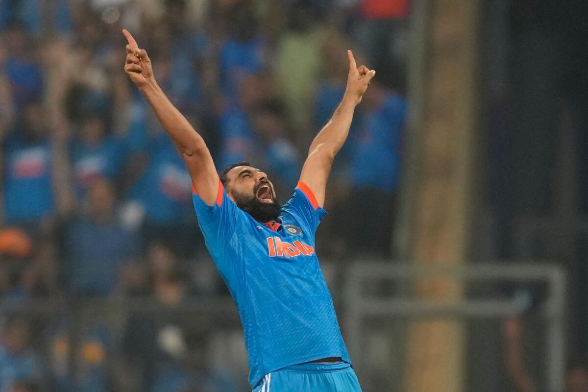 India's Mohammed Shami celebrates the wicket of New Zealand's Daryl Mitchell and also five wicket haul during the ICC Men's Cricket World Cup first semifinal match between India and New Zealand in Mumbai, India, Wednesday, Nov. 15, 2023. Photo: AP