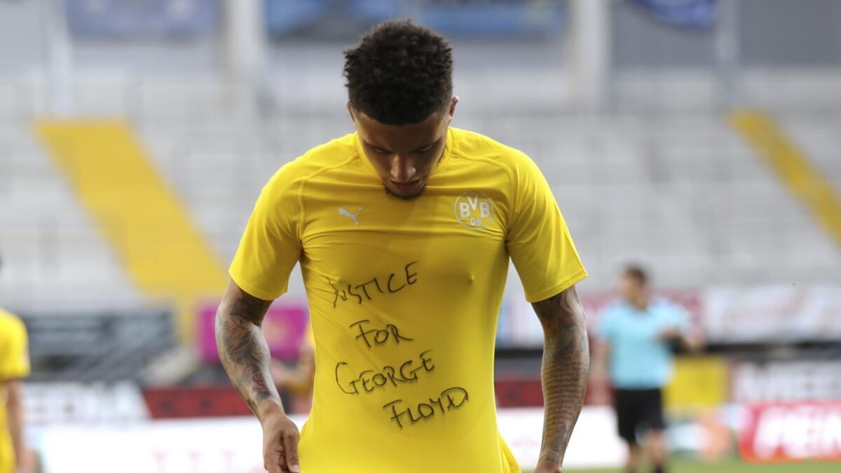 The German soccer federation is defending its decision to assess whether four players who made gestures in solidarity with George Floyd must face sanctions for their actions